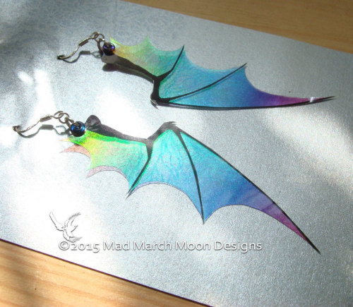 sosuperawesome:Iridescent dragon earrings, ear cuffs, hair clips, hair sticks and necklaces by MadMa