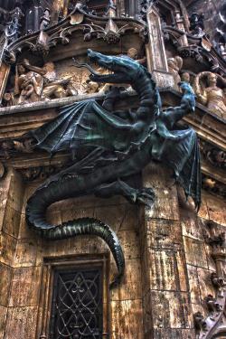 reachling:  loveliness-extreme:  pterobat:  Dragon grotesque on the Munich, Germany town hall  why would you call this grotesque? i love ittt  Grotesque in architecture terms means a carved figure.