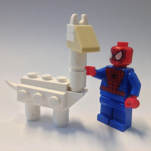 Spider-Man petting an alpaca in the snow