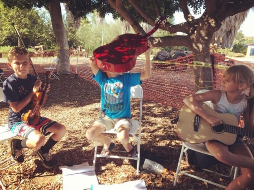 <p>We’ve all been there. At the moment of this photo, he yelled into the guitar, “I found it!” Also, when Patrick Sauber mentioned to him that some of the frets might be in the wrong place which was making it harder to tune, he said, “BUT IT’S RED!!!” #bluegrass #bluegrasscamp #summergrass #mypickfellin #redguitarbestguitar (at Summergrass San Diego)</p>