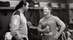wcwworldwide:  Scott Hall and Chris Jericho Backstage - WWF RAW Magazine [May 2002]The Bad Guy talking to Y2J, who is wearing a Stuck Mojo shirt. By this point in time, Jericho had already started working on his band Fozzy with Rich Ward and Frank Fontser