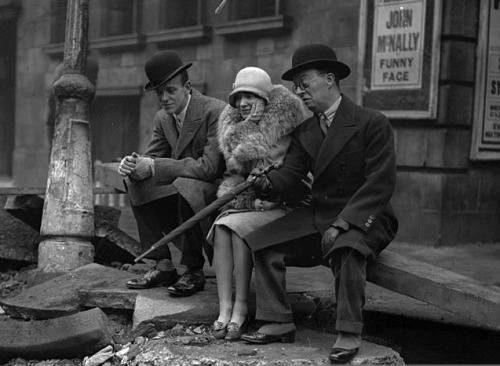 Fred Astaire and his sister Adele and actor Leslie Hanson are inspecting the damage after an explosi