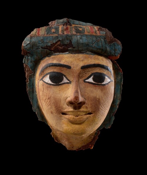 An Egyptian Polychrome Wood Mummy Mask21st/22nd Dynasty, 1075-716 B.C.The oval face with full outlin