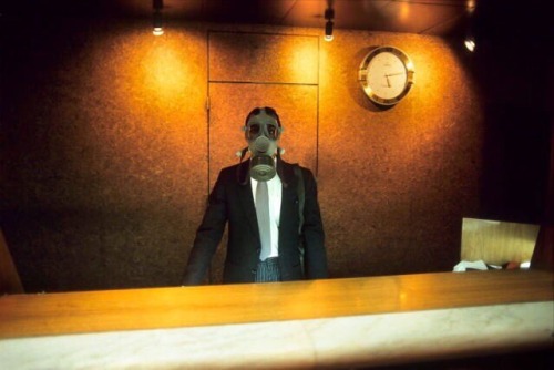 saudi-on-a-journeyy:  The receptionist of the Meridien hotel with a gas mask during a Scud alert in January 1991, Dhahran, Saudi Arabia.