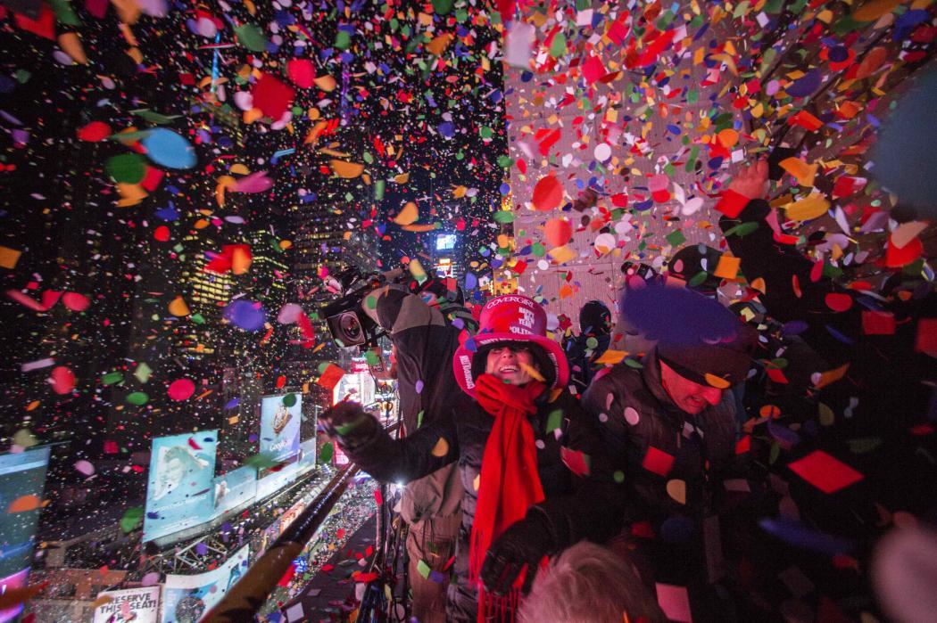 yahoonewsphotos:  2014 New Year’s Eve in NYC’s Times Square Since 1907, people