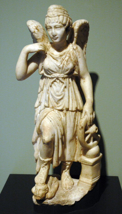 Ancient Roman statuette (Dolomitic marble) of the goddess Nemesis, with a “wheel of fortune” in her 
