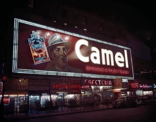 Camel billboard in Times Square, with real smoke coming out of the man’s mouth, 1949.