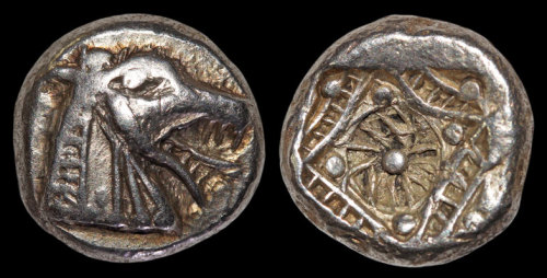 sixpenceee:  A 2500 year old silver coin from Turkey. Many speculate that it could possibly depict a sea monster, specifically the Trojan Sea Monster judging from it’s geographical location. (Source) 