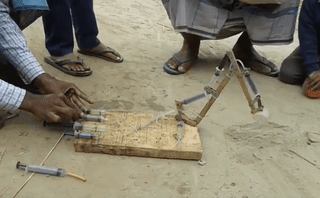 sixpenceee:Toy excavator made from syringes. (Source)