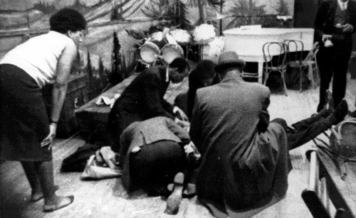  Followers tend to Malcolm X as he lies mortally wounded on the stage of the Audubon ballroom in Harlem after being shot on Feb. 21, 1965 - via reddit Read More