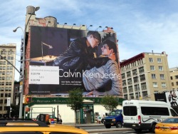 outofficial:  This week, New Yorkers woke up to find Calvin Klein Jeans’ new fall campaign, which features a gay couple for the first time in the brand’s history, posted on one of the biggest billboards in the city (read more)Photo: Julien Sauvalle