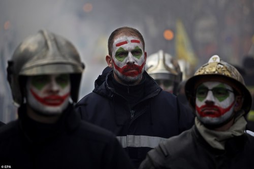 Some firefighters painted their face as ‘Joker’ as they participate in a demonstration against the p