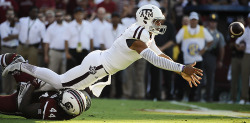 sportingnewsarchive:  &ldquo;Kenny Football&rdquo;Texas A&amp;M Football Kenny Hill throws a shovel pass against South Carolina Aug. 28, 2014. (Rainier Ehrhardt/AP)  