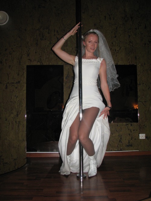 Sexy bride flashing tan pantyhose under her wedding dress.Bride in pantyhose