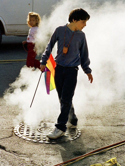 funkpunkandroll84: Boy holding a pride flag at a LGBT pride parade in San Francisco, June 1988, by D