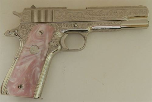 Colt 1911, chambered in .38 Super.