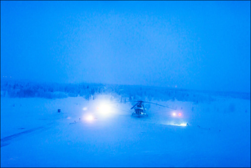 Helicopter prepares for taking off from helipad near Salekhard, Yamal region, Russia. 11.02.2014