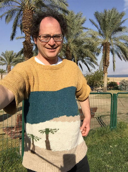 road-twitch:  mymodernmet: Guy Knits Sweaters of Places, Then Wears Them in Front of the Real Place  I still refuse to believe the world is 100% a flaming trash heap because look at this. 