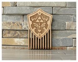 retrogamingblog:Wood-Burned Hylian Shield Comb made by LIMLazer