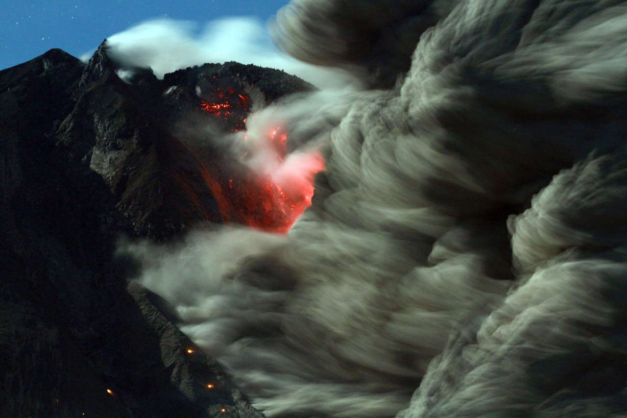 benadrylpapi:  Mount Sinabung spews hot lava and volcanic ash as it is seen from