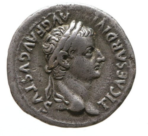 Denarius of the Roman emperor Tiberius (r. 14-37 CE), depicting him crowned with a laurel wreath; th
