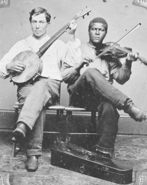 American tintype portrait of a white banjo player and a black fiddle player, c. 1860-1880.Source: So