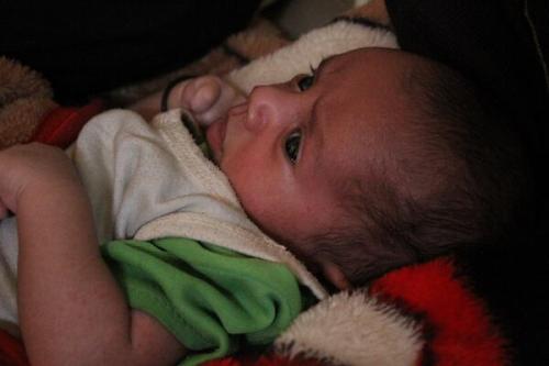 ernestsewell:  This is Mished.  He’s 15 days old.  He’s a cutie, ain’t he? His father was murdered by a random stranger last week, while he attended a wedding.  17 other children lost their fathers as well, all at the hands of the same murderer.