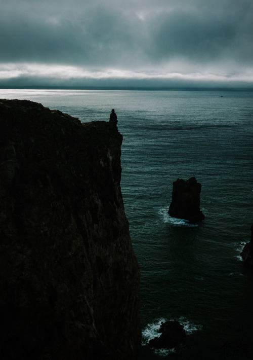 a lone figure at the edge of the earth