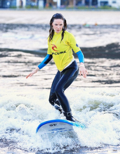 rebeccalouisaferguson:Rebecca Ferguson surfing in Surf Snowdonia adventure park, North Wales, UK| Ap