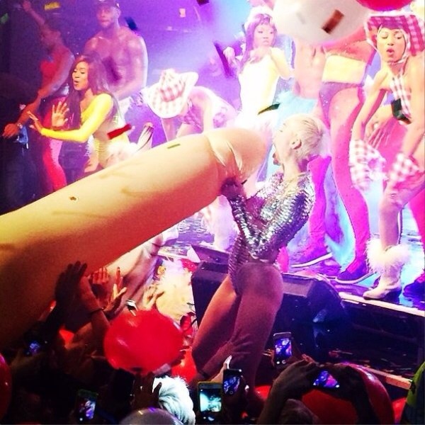 Miley Cyrus blowing a doll. More please!