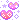 pixel art of two pink hearts, covered and surrounded by sparkles