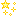 Yellow pixel art of sparkles and stars