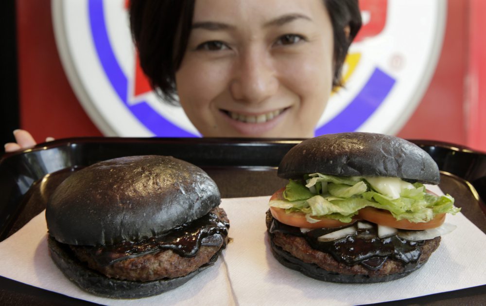 sixpenceee:  Burger King Japan is sporting an all-black burger, including the buns.