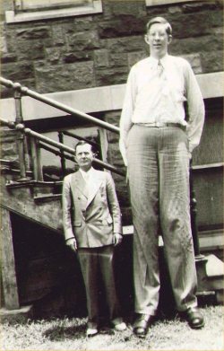 sixpenceee:  Robert Wadlow was the tallest person in history (1918-1940). He was 8 ft 11.1 in tall or 2.72 meters. His great size is due to his pituitary gland having a proliferation of cells. This resulted in increased levels of human growth hormone. 