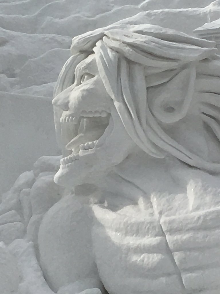 Close-ups of the Colossal Titan model and actual snow sculpture under construction,