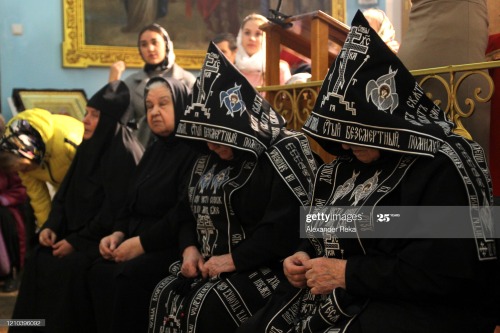 Schemanuns attend an Easter service at the Sts. Peter and Paul’s Cathedral, Luhansk.