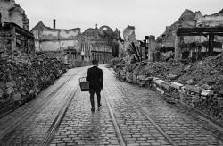 collectivehistory:  A man walks through a destroyed city in Germany looking for food, 1945, by Werner Bischof.  