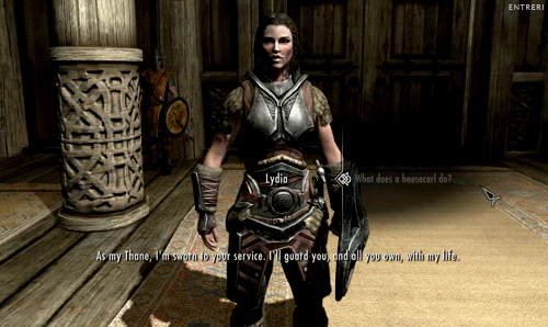 Lydia from Skyrim reponding to a "What does a housecarl do?" question, saying, "As my Thane, I'm sworn to your service. I'll guard you, and all you own, with my life."