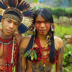 ^Kalinago men, Arawak Caribs^Traditional Pre-Columbian Karbet, or Meeting House^Kalinago tour guide^