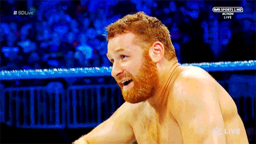mith-gifs-wrestling: A smile and a wink from Sami Zayn.