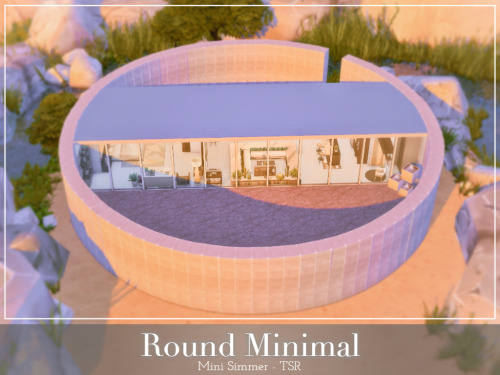 Round Minimal This is a small round house surrounded by large rocks and a natural pond. It is b