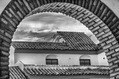 View Through An Arch by Me in ME This was taken at the Palacio Viana and is a view through this arch