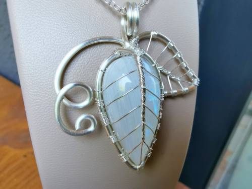 Leaf with vines pendant made with a moonstone :).You can order it at my Etsy shop: https://etsy.me/2