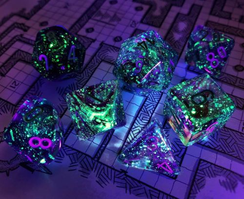 A gorgeous Nebula Nocturnal test set by Chessex[Image description: A translucent clear/purple/blue