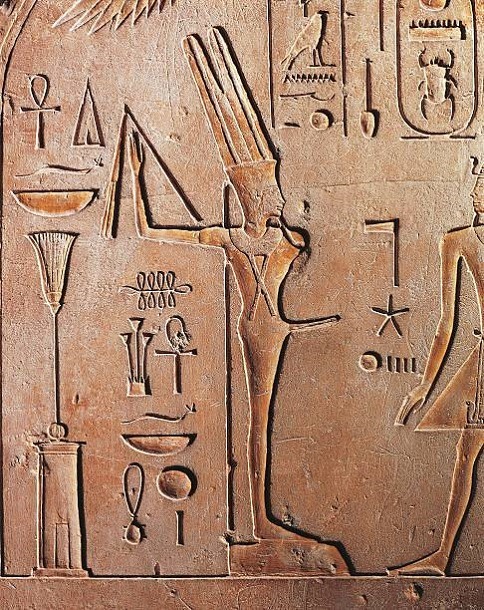 Stele of Thutmose IIIArched stele with traces of color and relief depicting Thutmose III before the 