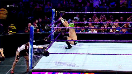Kalisto with a somersault senton to the outside against Jack Gallagher.