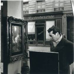 hauntedbystorytelling:  Robert Doisneau :: Un regard oblique / A Sidelong Glance, Romi’s art Gallery, Paris, 1948For his Life magazine assignment, Doisneau hid his Rolliflex camera behind an antique chair on display at Romi’s art gallery in the 5th