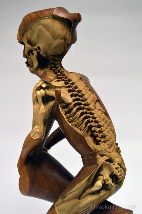 archiemcphee:  Canadian artist Maskull Lasserre (previously featured here) has recently been “re-carving” mass-produced wooden souvenir sculptures and decoys to reveal intricate an skeletal system beneath each sculpture’s wooden skin. These fascinating
