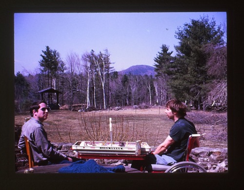 1974, living the good life: beer, table hockey, landscape.