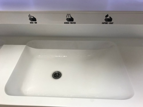 Two different restrooms at the airport of Rome in Italy . They did have urinals, it was difficult to